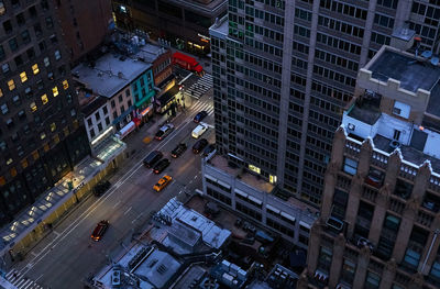 High angle view of illuminated city street and buildings in manhattan