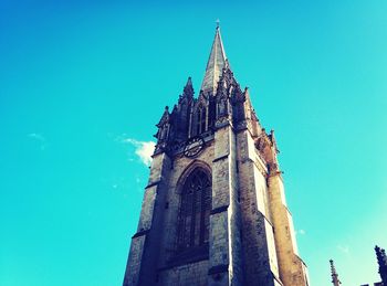 Low angle view of church against clear blue sky