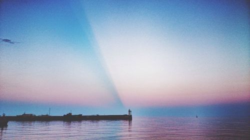 Scenic view of sea at sunset