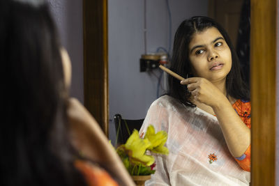 Portrait of young woman looking away