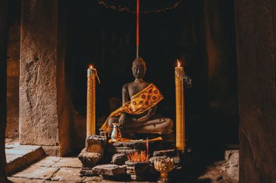 Illuminated candles in temple