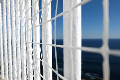 Full frame shot of fence by sea