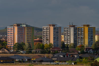 Buildings in city against sky