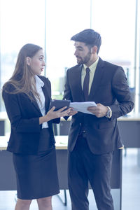 Young couple holding smart phone