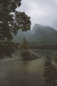 Scenic view of landscape and mountains against sky