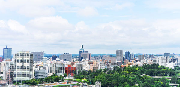 Buildings in city against sky