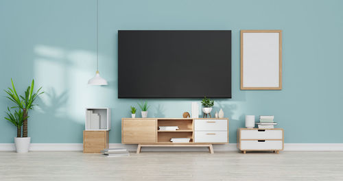 Empty chairs and table against wall at home