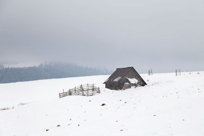 Scenic view of snow field against sky