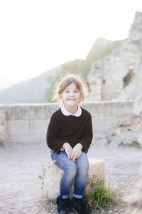 Portrait of smiling boy against sky