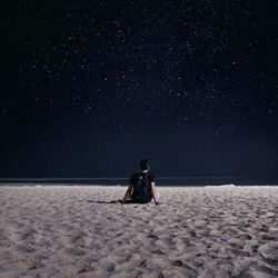 Full length of woman in dark room