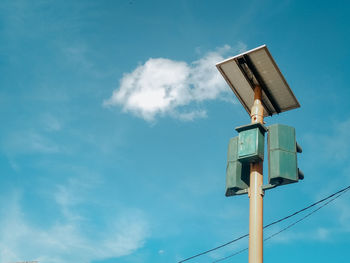 Low angle view of pole against blue sky