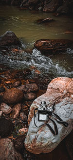 High angle view of river flowing through rocks