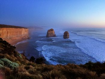 Scenic view of sea against clear blue sky