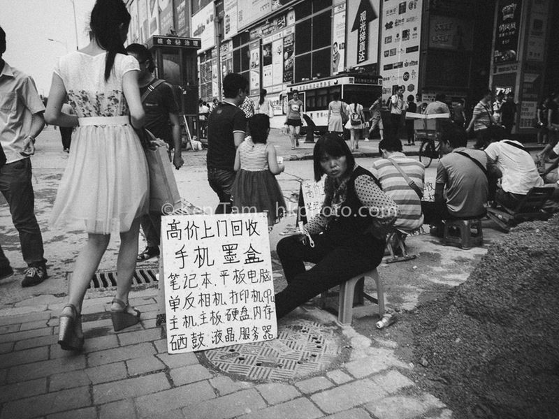 men, street, city, building exterior, lifestyles, text, person, communication, city life, architecture, walking, built structure, leisure activity, market, western script, casual clothing, rear view, retail