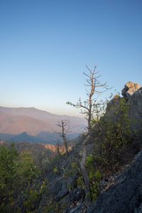 Scenic view of mountains against clear blue sky