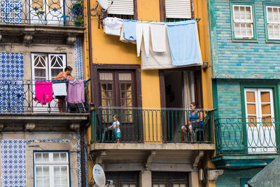 Low angle view of clothes drying outside building