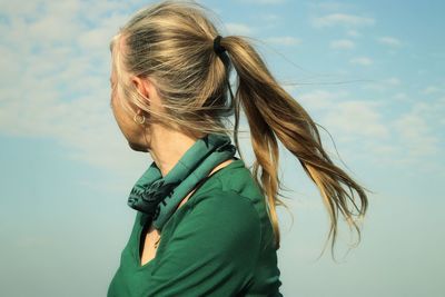 Portrait of woman against sky