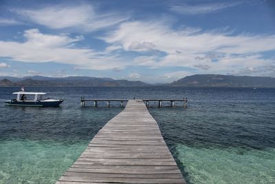 Pier over sea against sky