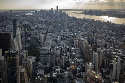 High angle view of city buildings against sky