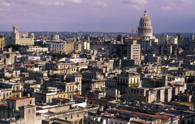 High angle view of city against cloudy sky