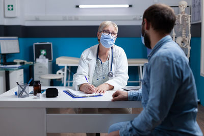 Portrait of female doctor working in office