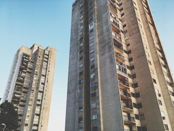 Low angle view of buildings against sky in city