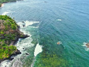 High angle view of rocks by sea