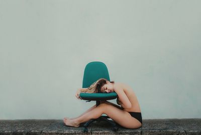 Young woman sitting outdoors