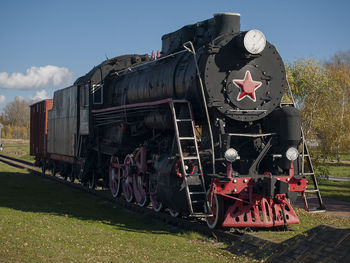 Train on railroad track against sky