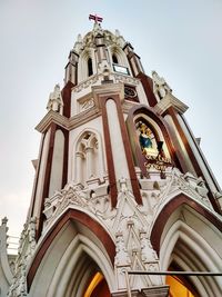 Low angle view of ornate building against sky