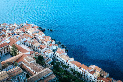 High angle view of townscape by sea