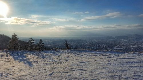 Scenic view of frozen landscape against sky