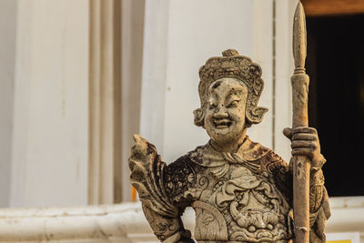 Close-up of statue against temple