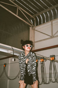 Portrait of thai girl with double bun wearing zebra print top