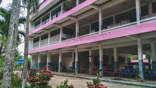 Buildings by footpath in city