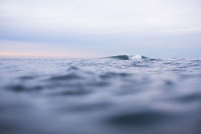 Surface level of sea against sky