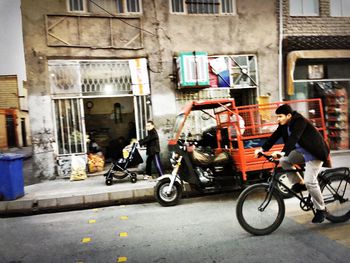 People parked in front of building