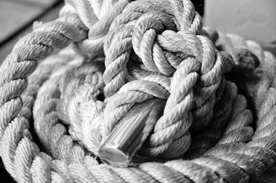 Close-up of rope tied on cleat at harbor