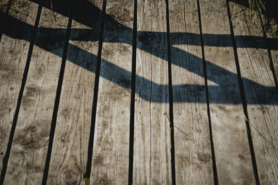 High angle view of shadow on hardwood floor