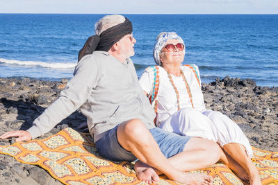 Senior couple relaxing at beach