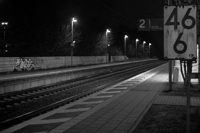 Railroad station platform at night