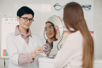 Woman trying eyeglasses