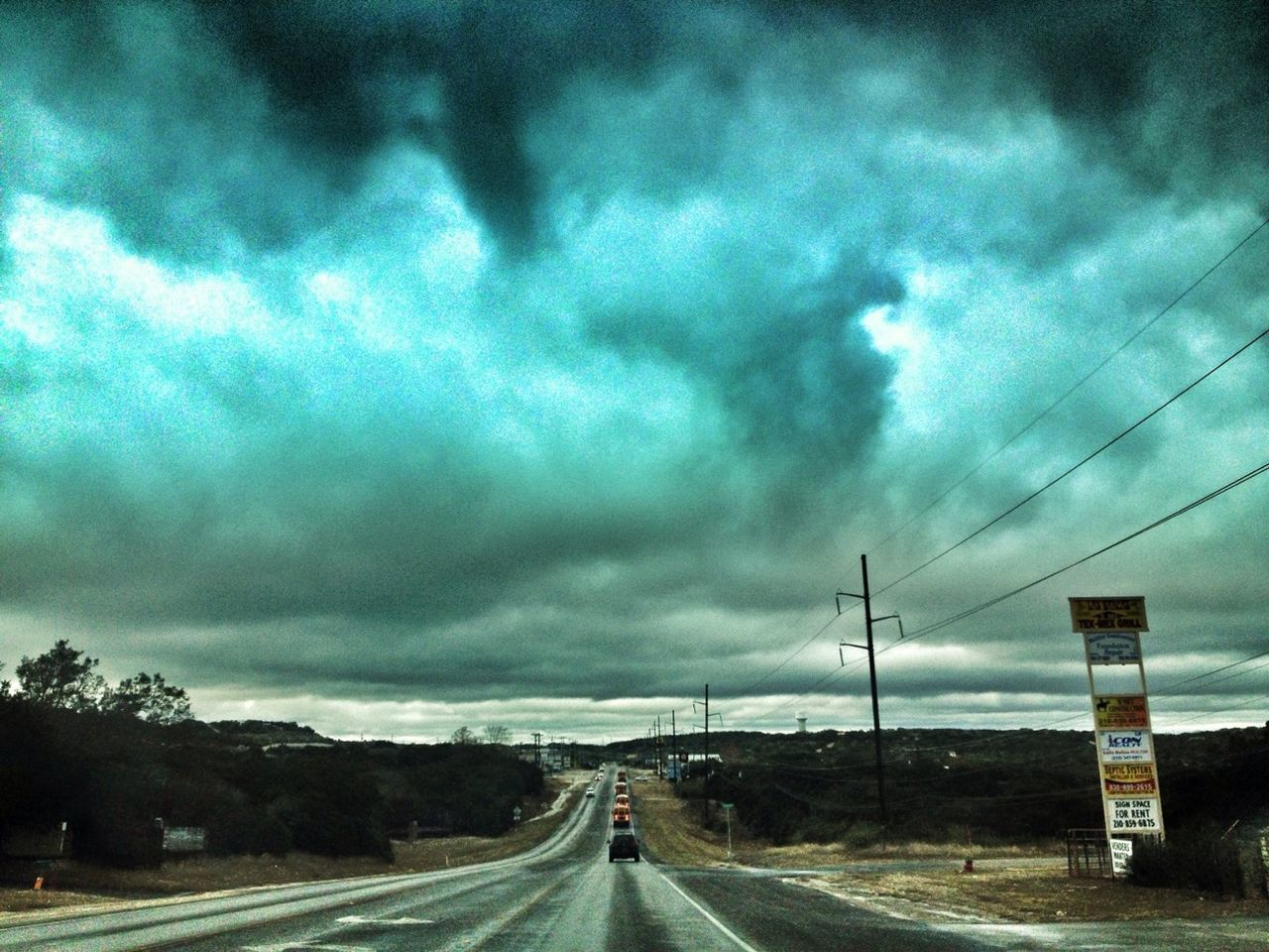 transportation, the way forward, sky, cloud - sky, road, cloudy, diminishing perspective, vanishing point, weather, storm cloud, cloud, car, road marking, overcast, dramatic sky, highway, mode of transport, land vehicle, street, atmospheric mood