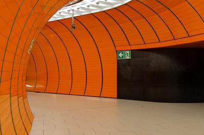 Illuminated text on wall at subway station
