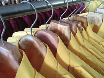 Close-up of clothes hanging in store for sale