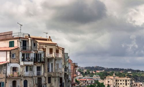 Buildings in city against sky