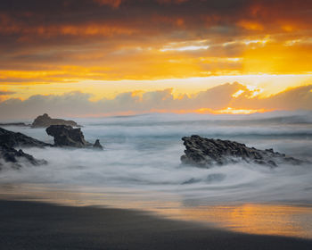 Scenic view of sea against sky during sunset