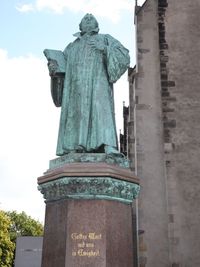 Low angle view of statue against the sky