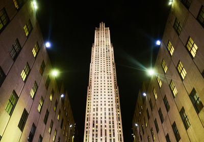 Low angle view of illuminated buildings at night