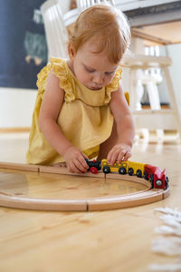 Boy playing with toy at home